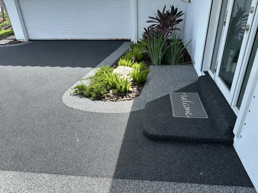 Close-up of a dark charcoal rubber stone surface at an entrance