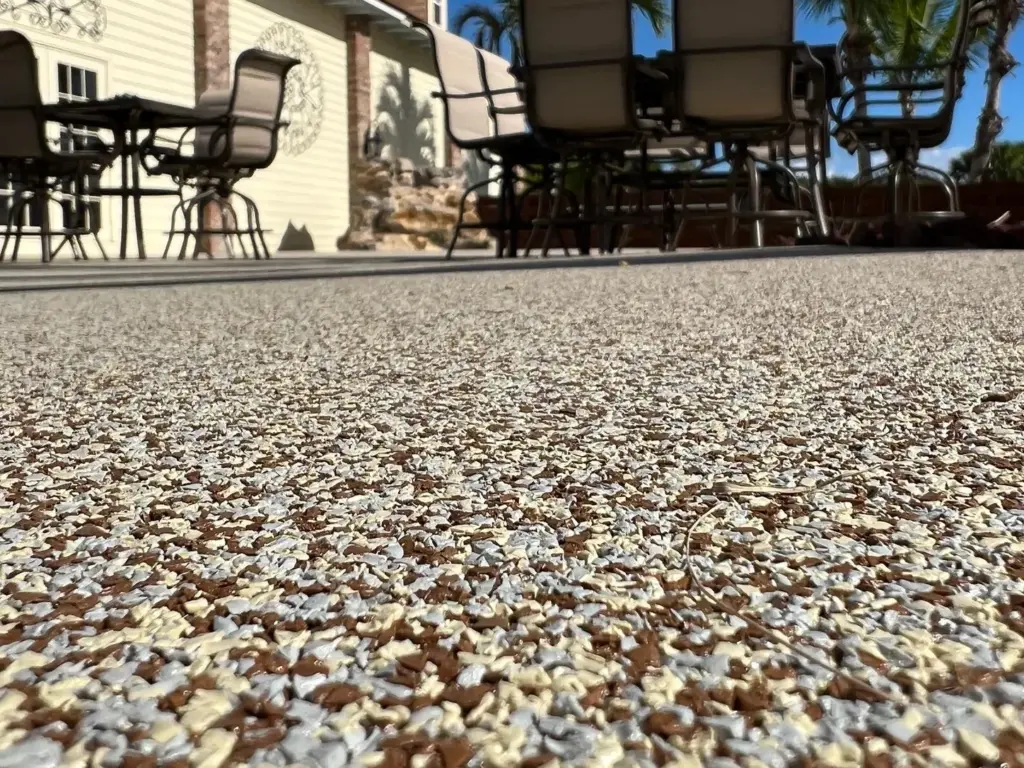 Close-up of a warm mixed-aggregate rubber stone surface