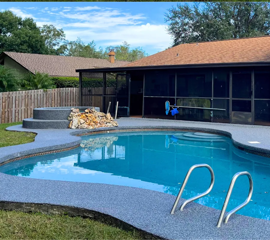 Pool deck after an upgrade with a blue-grey rubber surface